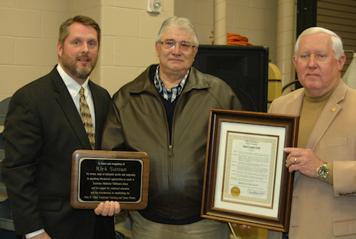Rick Sutton (center) receives awards from Tony Cain (left) and Bill Elmore (right)