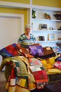 Ellen Butler with the Piecemaker’s Quilt group delivers quilts to the Home.