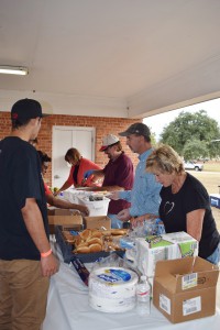 Volunteers from WestRock serve dinner to our youth and staff.
