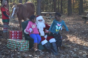 Santa Claus visits with kids.
